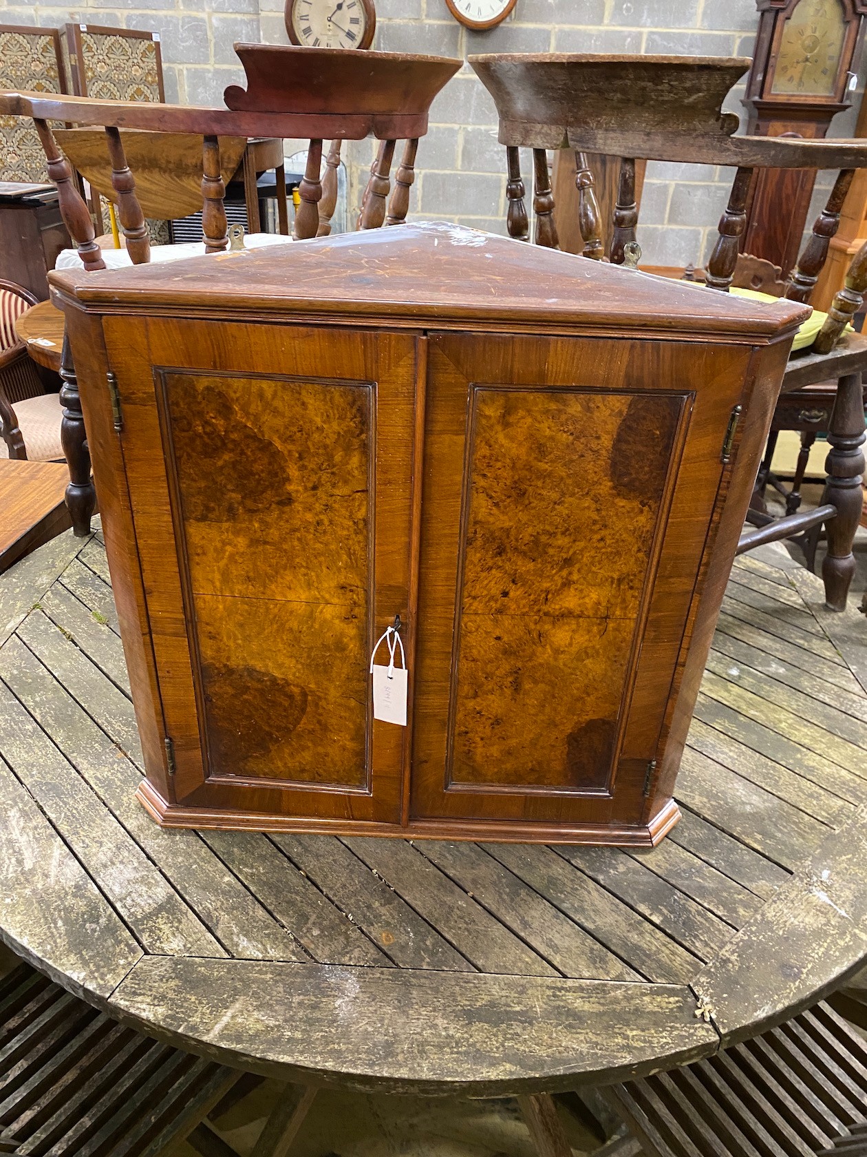 A Victorian style burr walnut hanging corner cabinet, width 63cm, depth 35cm, height 62cm